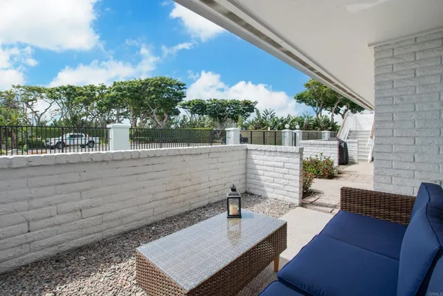 a view of a patio with swimming pool table and chairs