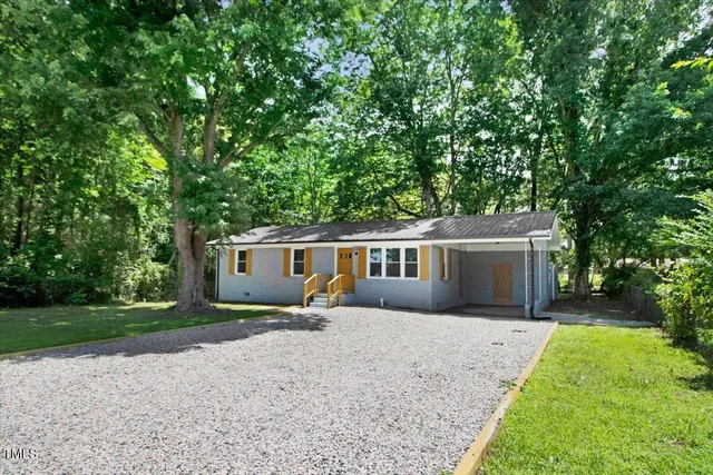 front view of a house with a yard