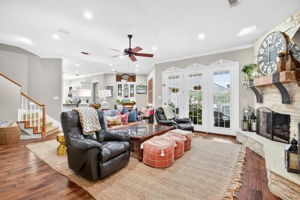 a living room with fireplace furniture and a flat screen tv