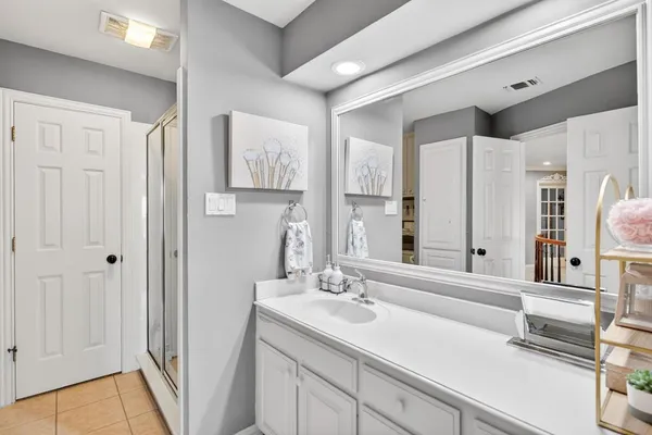 a living room with furniture and a bookshelf