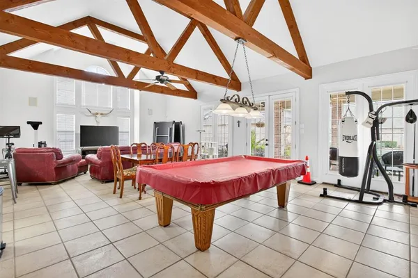 a kitchen with stainless steel appliances granite countertop wooden cabinets a sink and dishwasher a refrigerator with wooden cabinets