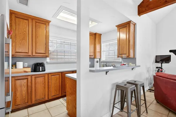 a living room with furniture a ceiling fan and a window