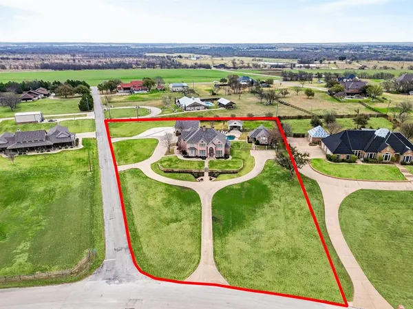 an aerial view of a house with garden