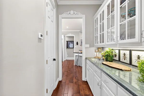a kitchen with a sink cabinets and window
