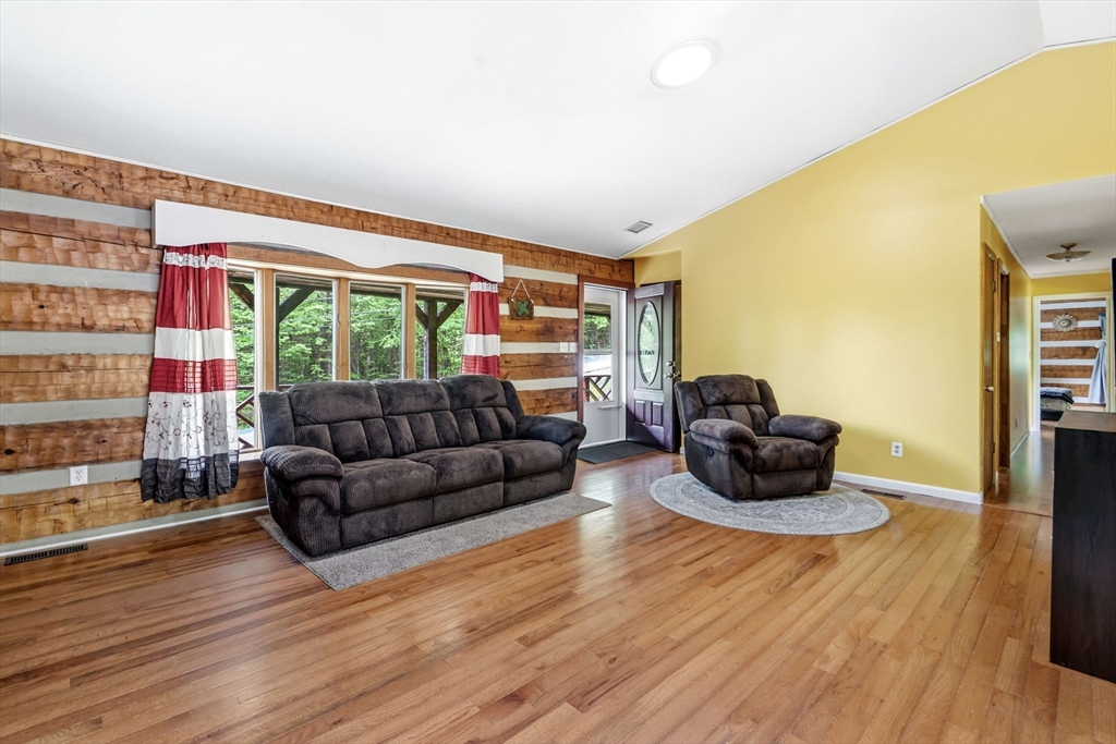 22 Lyon Hill Road Chester, MA 01011 - Photo 18 of 38 a living room with furniture and a wooden floor