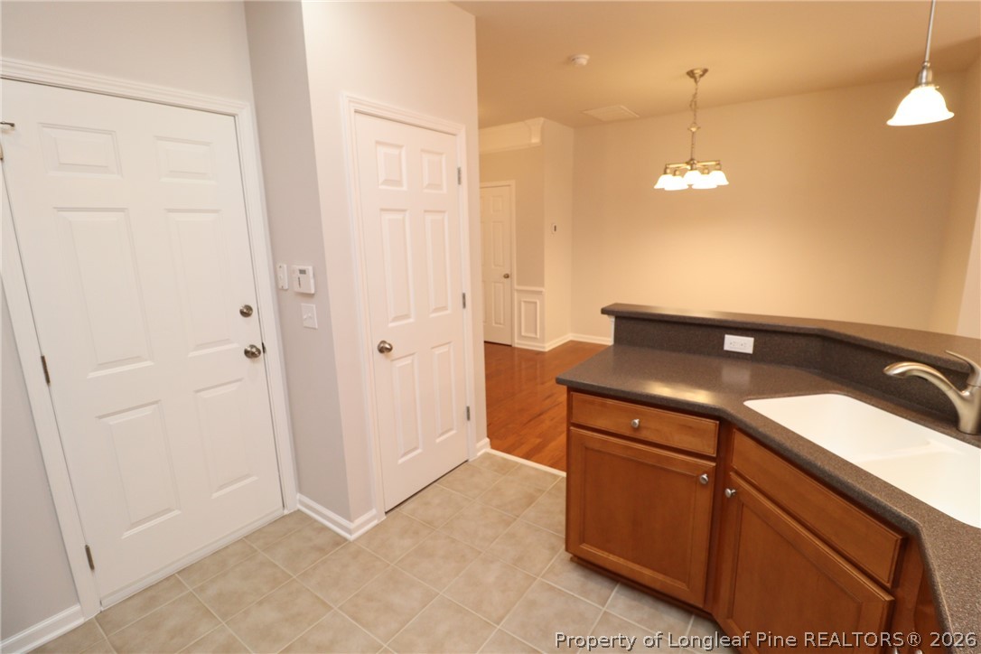 7122 Racine Way Raleigh, NC 27615 - Photo 11 of 32 a view of an empty room and kitchen view
