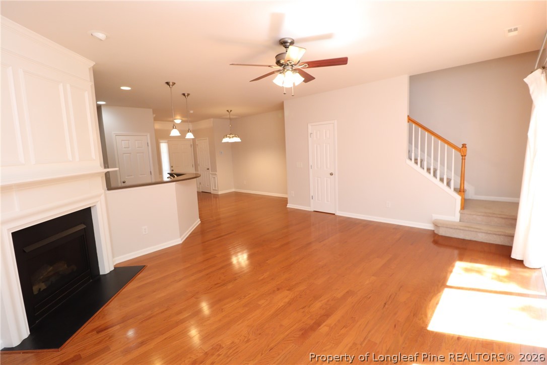 7122 Racine Way Raleigh, NC 27615 - Photo 13 of 32 a view of a living room with a fireplace