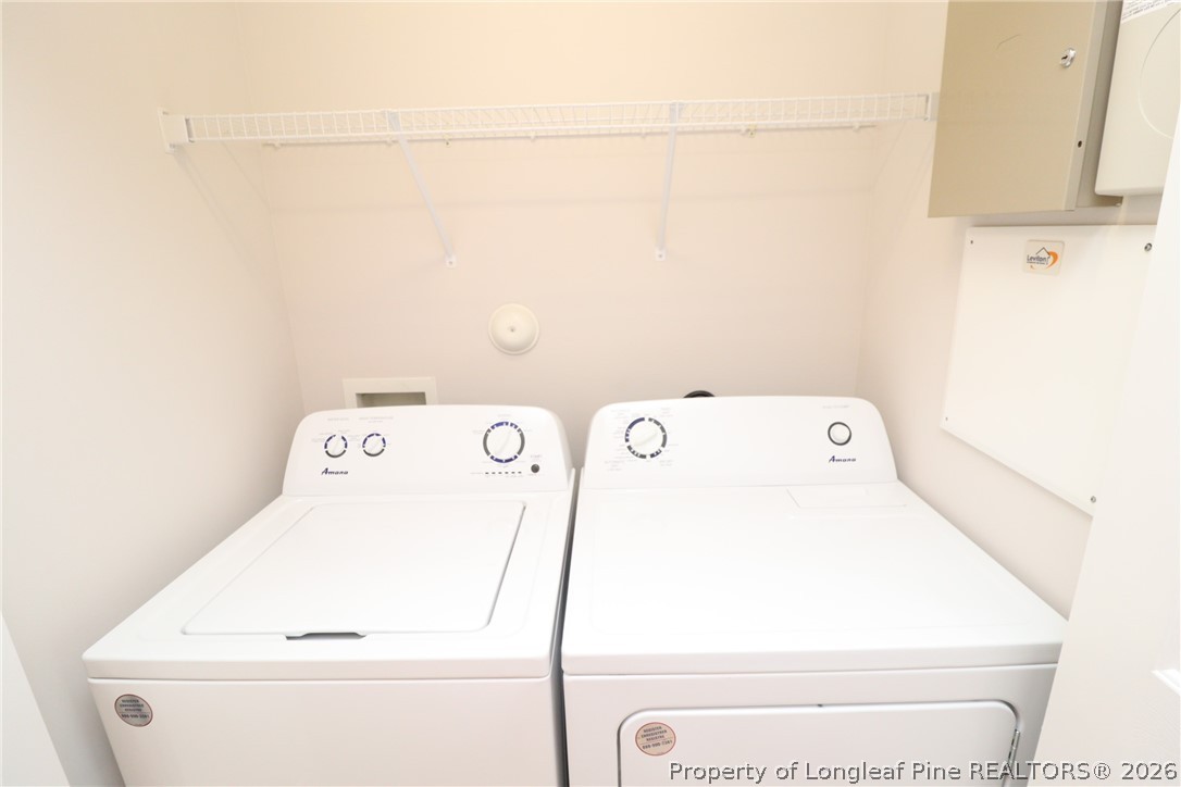 7122 Racine Way Raleigh, NC 27615 - Photo 16 of 32 a utility room with dryer and washer