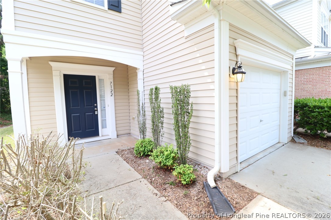 7122 Racine Way Raleigh, NC 27615 - Photo 2 of 32 a front view of a house with a yard
