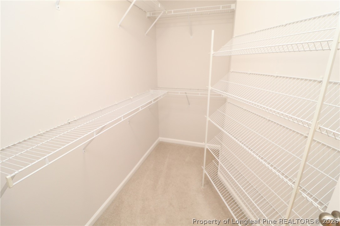 7122 Racine Way Raleigh, NC 27615 - Photo 23 of 32 a view of small space with racks on the wall
