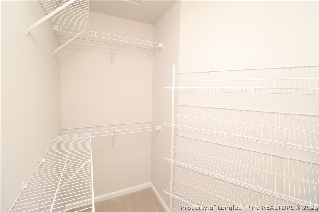 7122 Racine Way Raleigh, NC 27615 - Photo 24 of 32 a bathroom with a shower