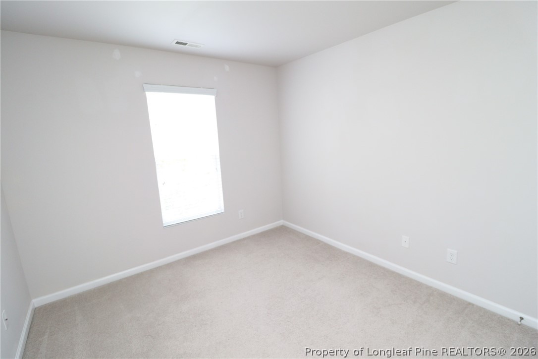 7122 Racine Way Raleigh, NC 27615 - Photo 28 of 32 an empty room with a window