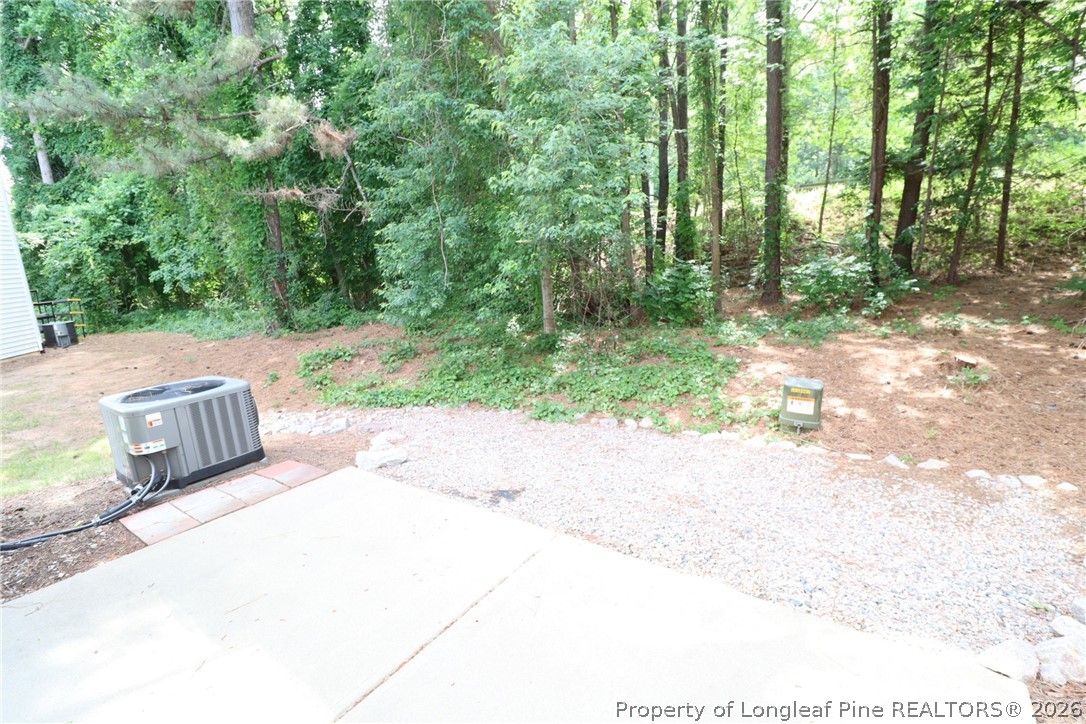 7122 Racine Way Raleigh, NC 27615 - Photo 31 of 32 a view of backyard with green space