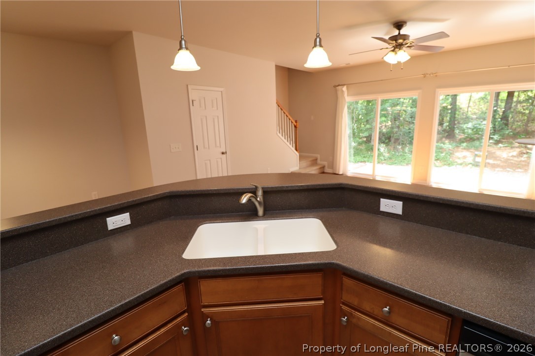 7122 Racine Way Raleigh, NC 27615 - Photo 8 of 32 a bathroom with a sink a large mirror and a window