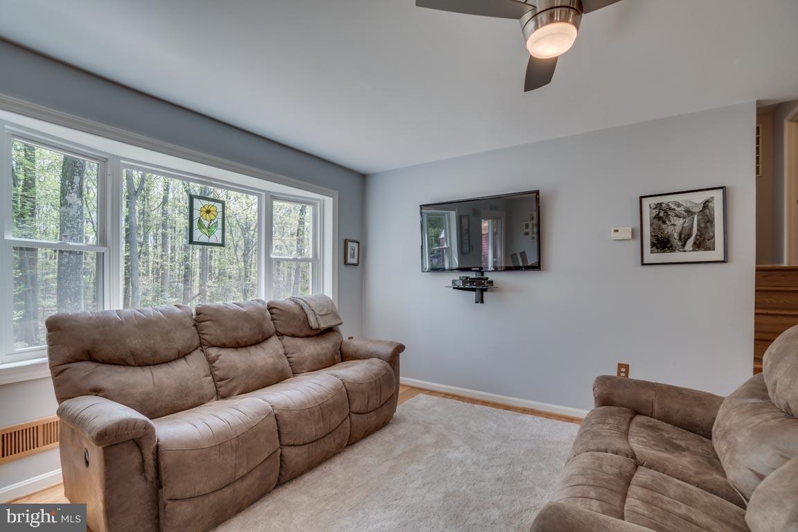 13663 Van Doren Road Manassas, VA 20112 - Photo 11 of 33 a living room with furniture and a flat screen tv