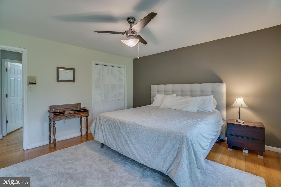 13663 Van Doren Road Manassas, VA 20112 - Photo 14 of 33 a bedroom with a bed and a ceiling fan