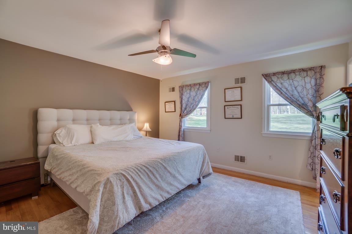 13663 Van Doren Road Manassas, VA 20112 - Photo 16 of 33 a bedroom with a bed and a window