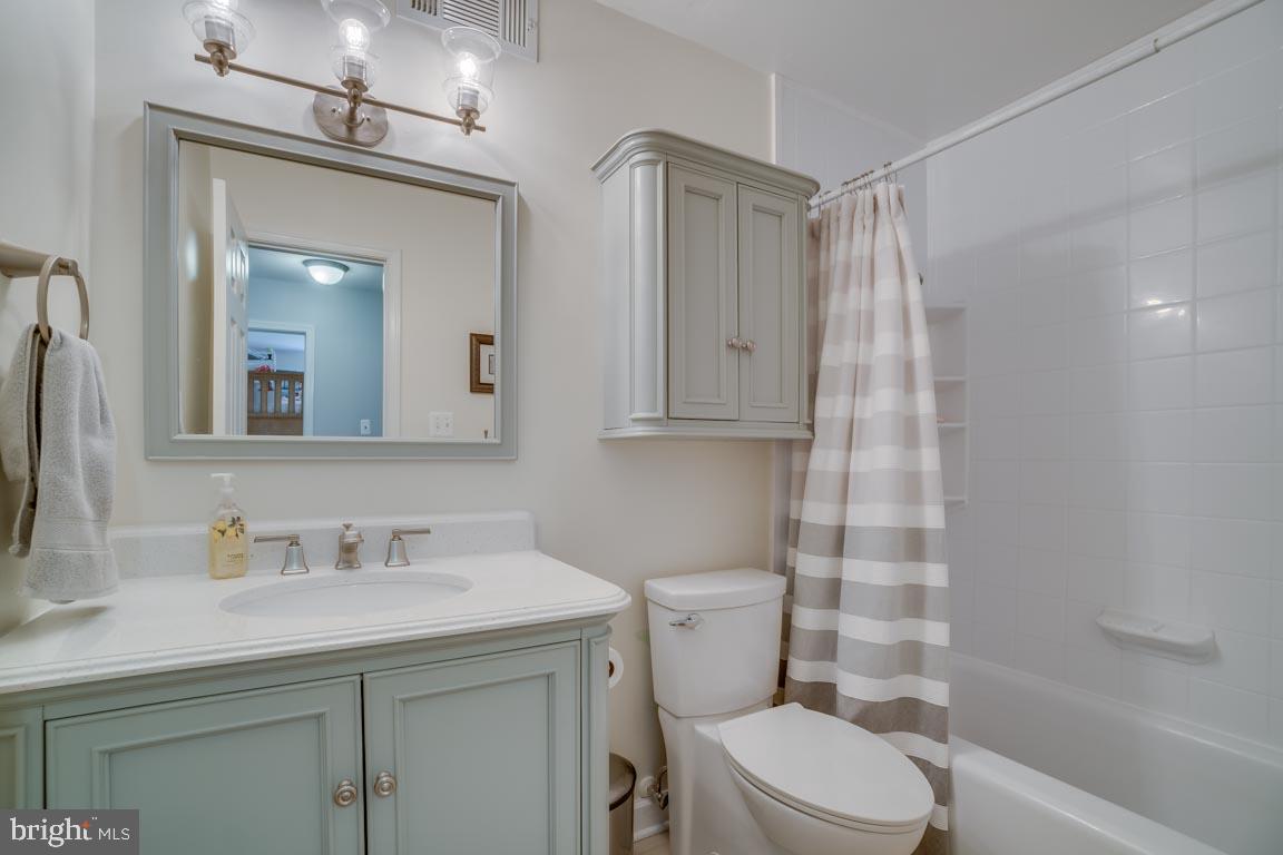13663 Van Doren Road Manassas, VA 20112 - Photo 19 of 33 a bathroom with a sink a toilet and shower