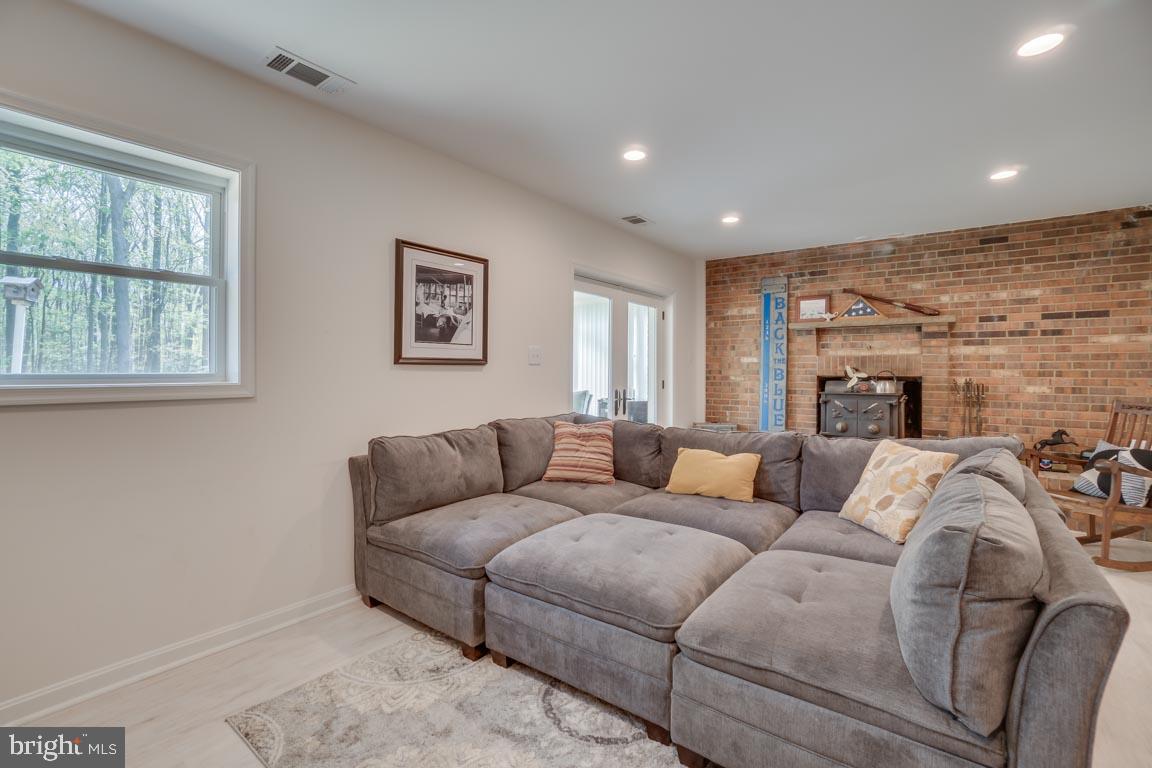 13663 Van Doren Road Manassas, VA 20112 - Photo 22 of 33 a living room with fireplace furniture and a window