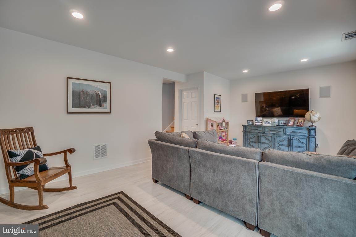 13663 Van Doren Road Manassas, VA 20112 - Photo 24 of 33 a living room with furniture and a flat screen tv