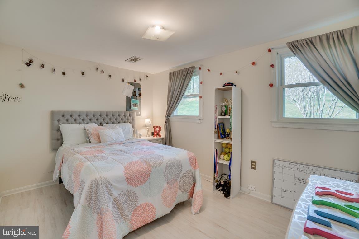 13663 Van Doren Road Manassas, VA 20112 - Photo 26 of 33 a bedroom with a bed and a window