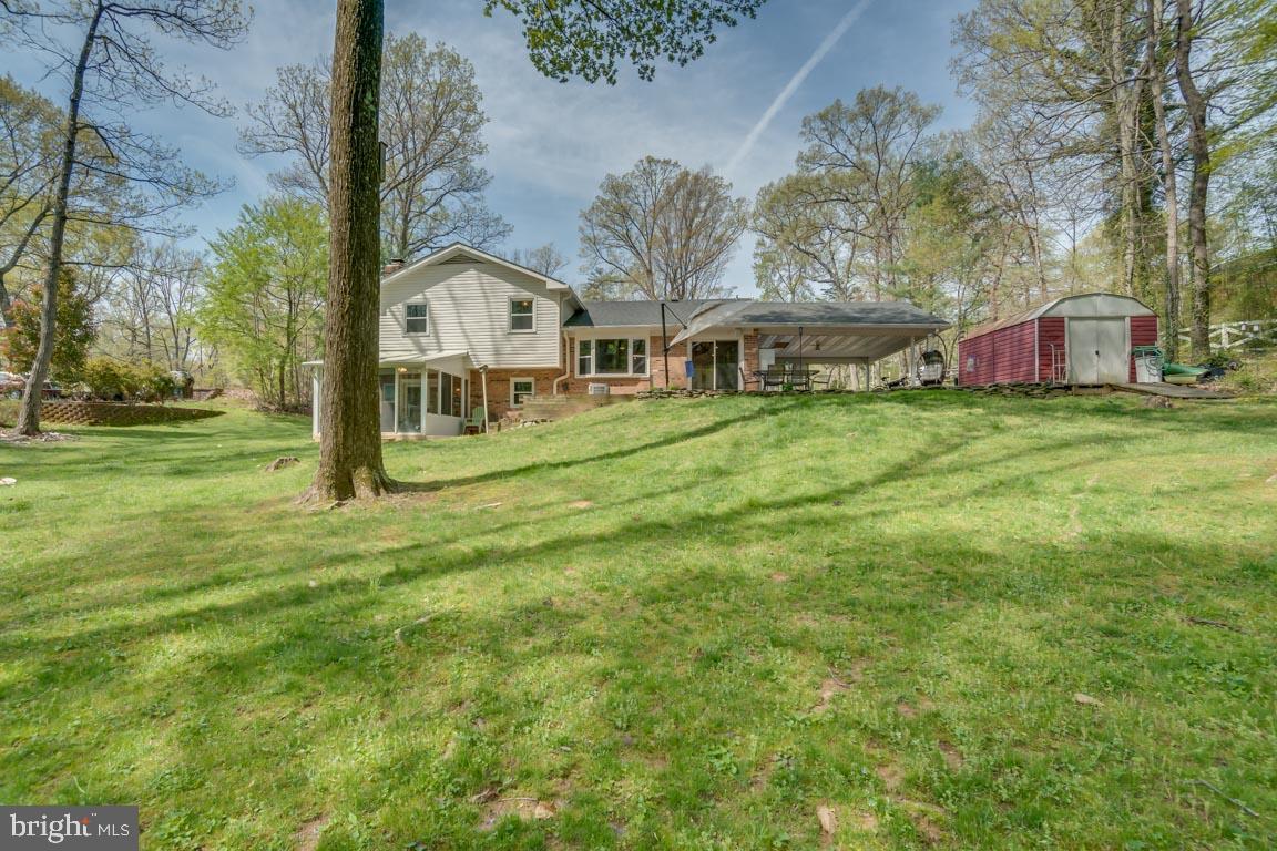 13663 Van Doren Road Manassas, VA 20112 - Photo 31 of 33 a front view of a house with a yard