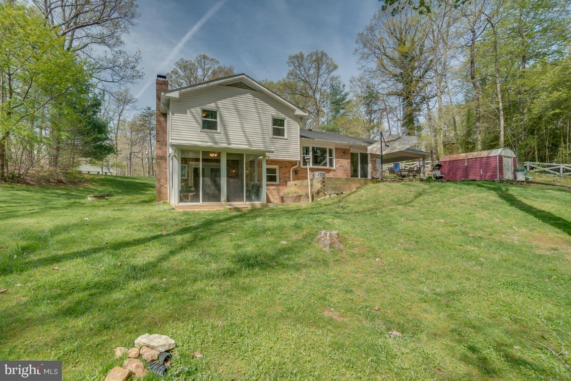 13663 Van Doren Road Manassas, VA 20112 - Photo 32 of 33 a front view of a house with garden