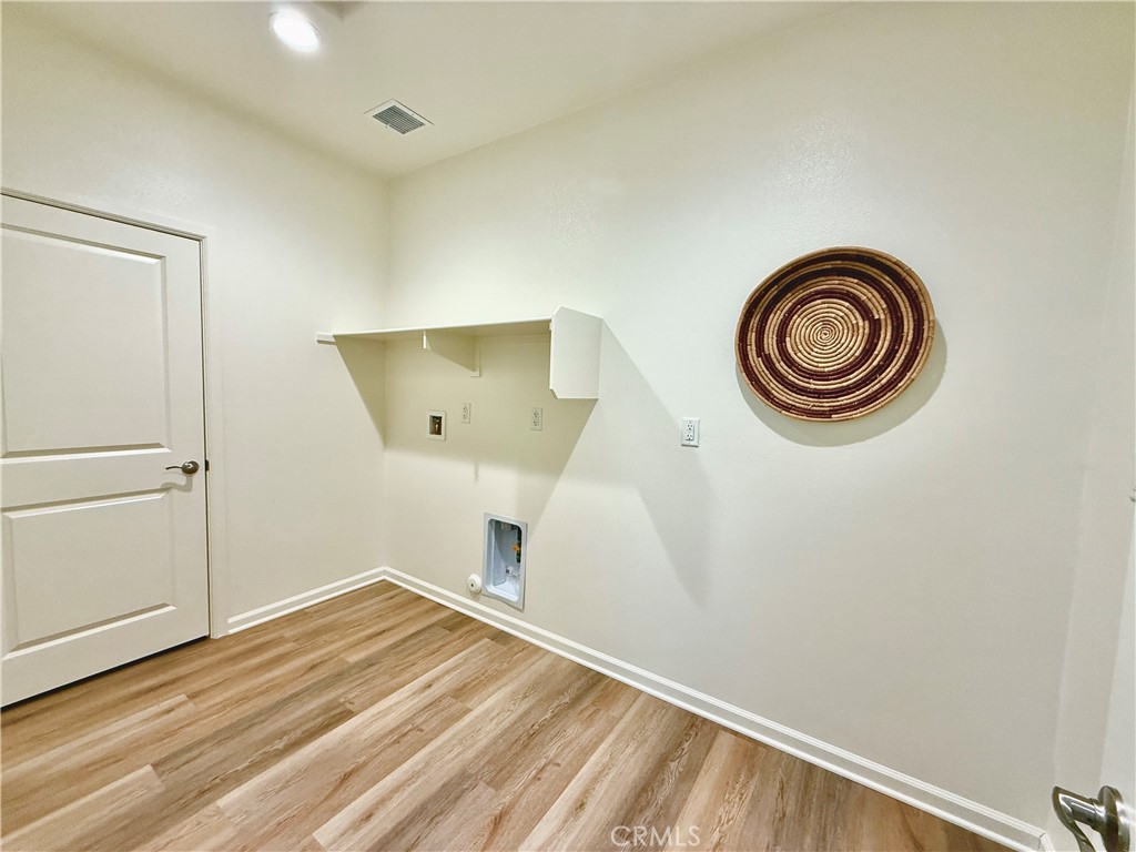 36237 Sunset Ridge Court Wildomar, CA 92595 - Photo 12 of 41 a view of empty room with wooden floor