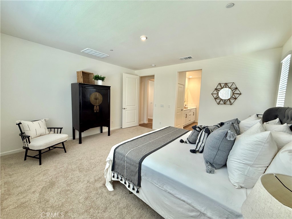 36237 Sunset Ridge Court Wildomar, CA 92595 - Photo 15 of 41 a bedroom with a bed and a couch