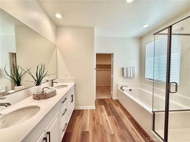 a spacious bathroom with a granite countertop sink mirror and