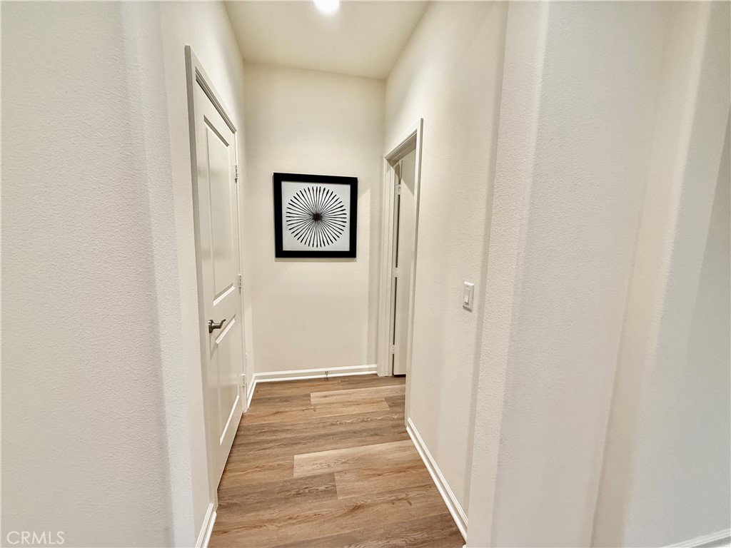 36237 Sunset Ridge Court Wildomar, CA 92595 - Photo 21 of 41 a view of a hallway with wooden floor
