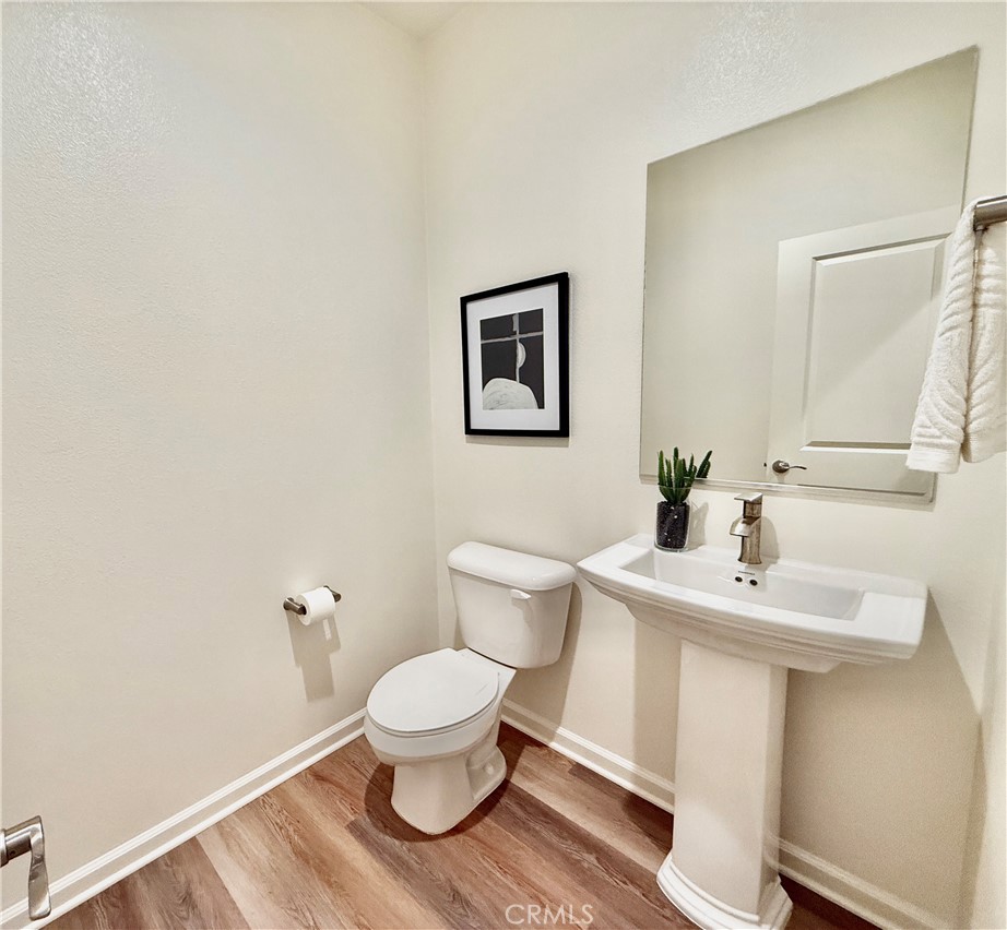 36237 Sunset Ridge Court Wildomar, CA 92595 - Photo 22 of 41 a bathroom with a sink toilet and a mirror