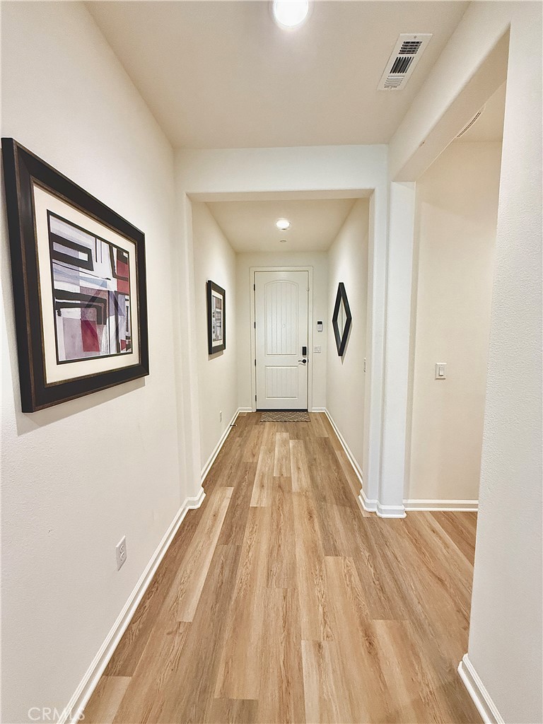 36237 Sunset Ridge Court Wildomar, CA 92595 - Photo 23 of 41 a view of empty room with wooden floor