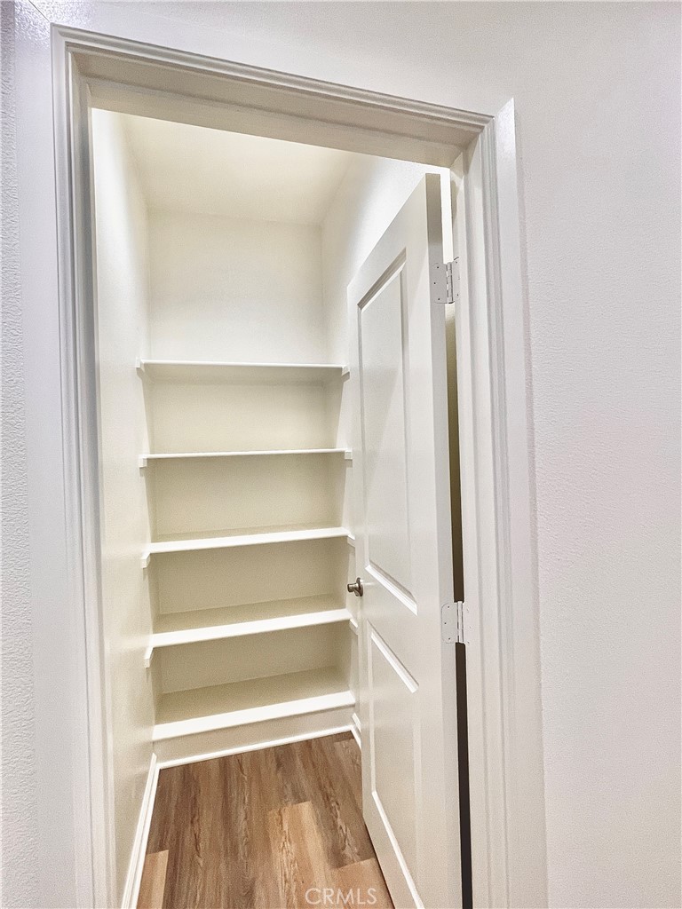 36237 Sunset Ridge Court Wildomar, CA 92595 - Photo 25 of 41 a view of walk in closet with empty racks