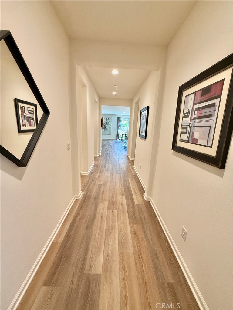 36237 Sunset Ridge Court Wildomar, CA 92595 - Photo 3 of 41 a view of a hallway with wooden floor and closet