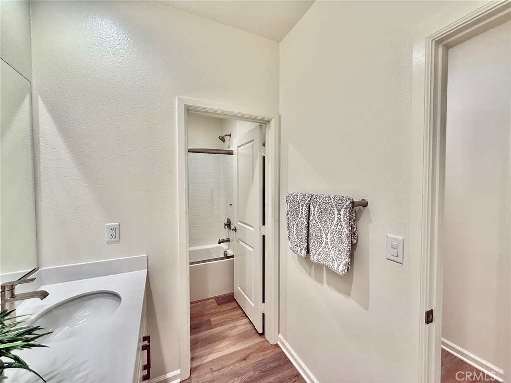 36237 Sunset Ridge Court Wildomar, CA 92595 - Photo 31 of 41 a bathroom with a sink and mirror