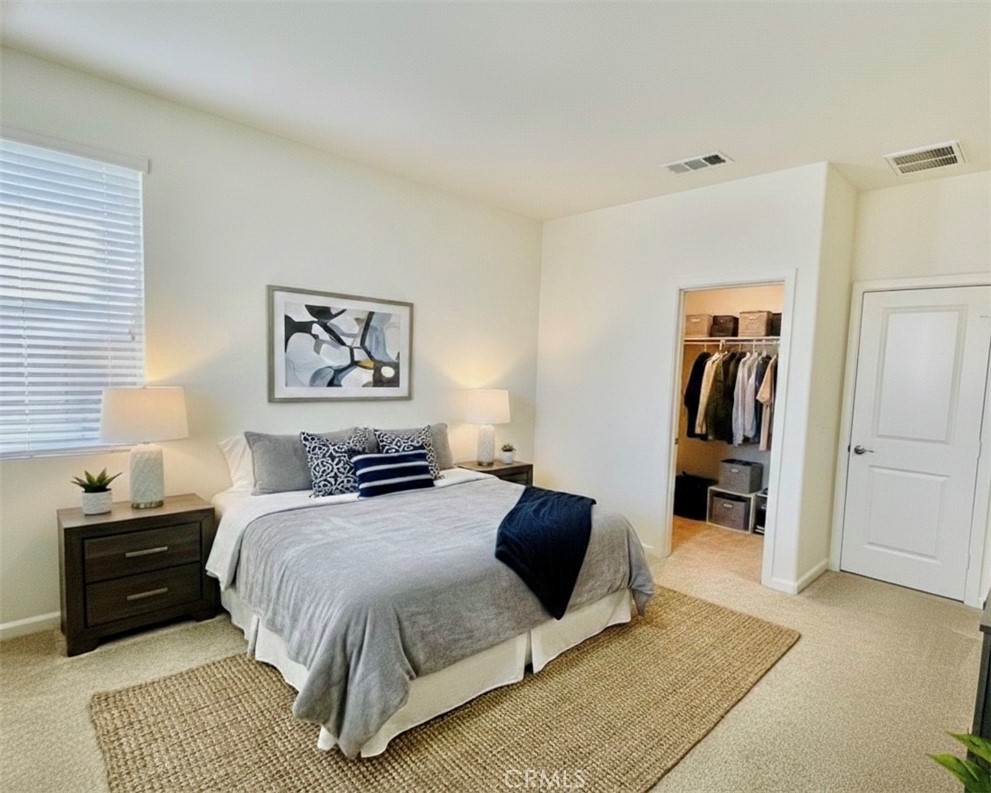 36237 Sunset Ridge Court Wildomar, CA 92595 - Photo 32 of 41 a bedroom with a bed and a rug