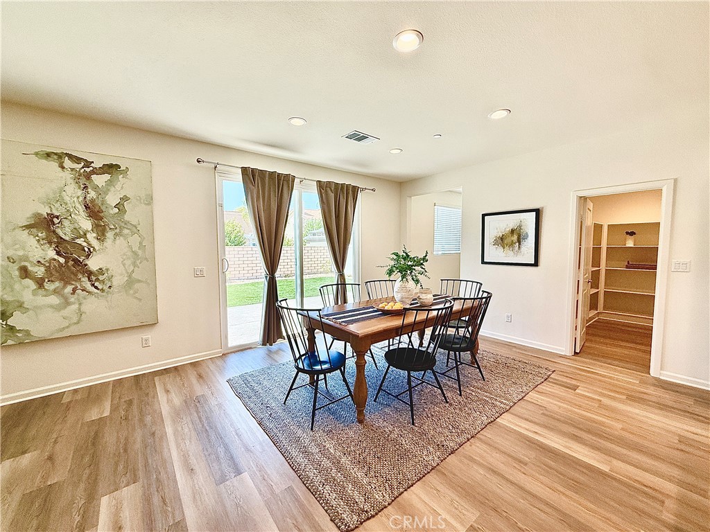36237 Sunset Ridge Court Wildomar, CA 92595 - Photo 7 of 41 a dining room with furniture and wooden floor