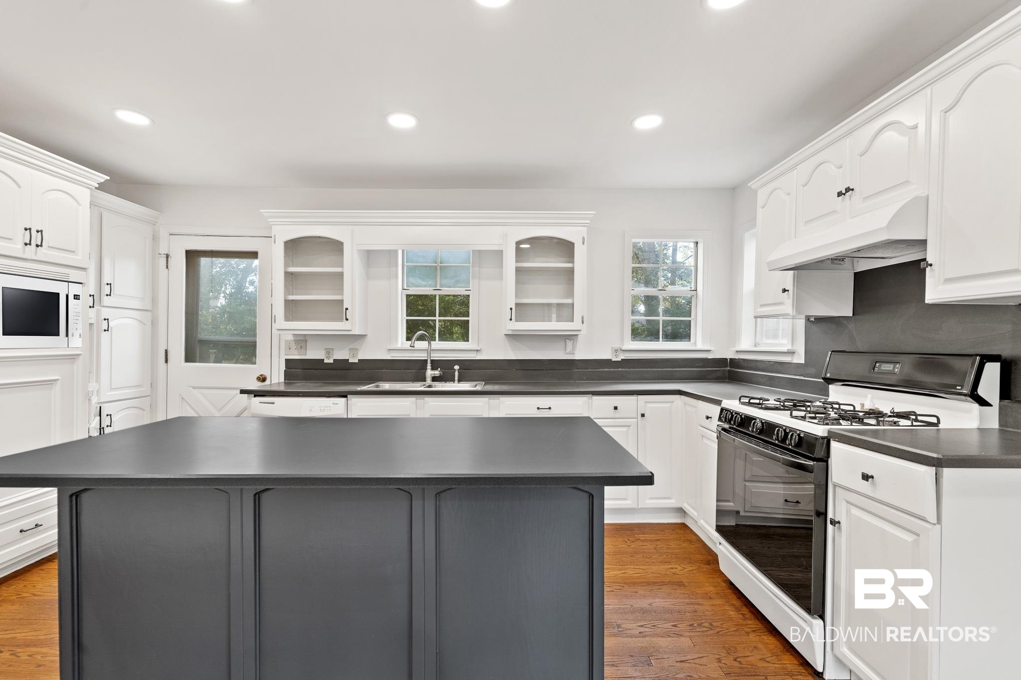 304 Liberty Street Fairhope, AL 36532 - Photo 9 of 25 Updated painted cabinets and nice island