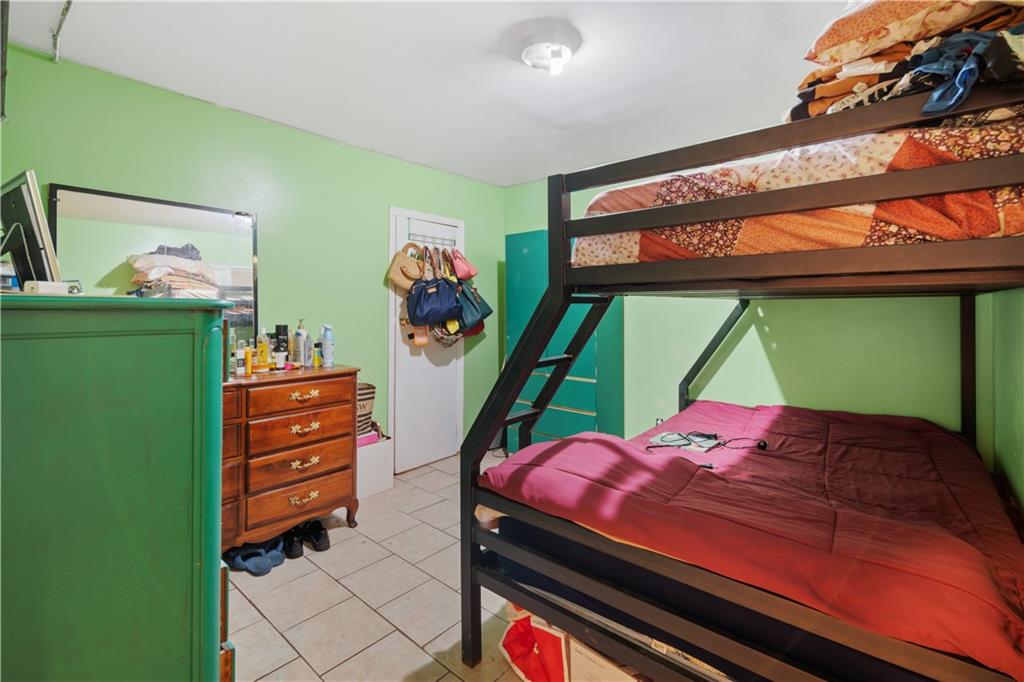 8 Raleigh Place Brooklyn, NY 11226 - Photo 13 of 21 a room with furniture and a window