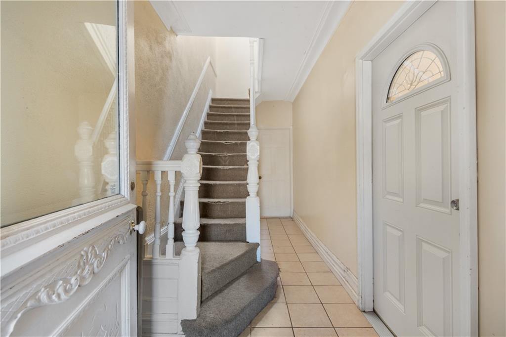 8 Raleigh Place Brooklyn, NY 11226 - Photo 2 of 21 a view of a livingroom with wooden floor and entryway