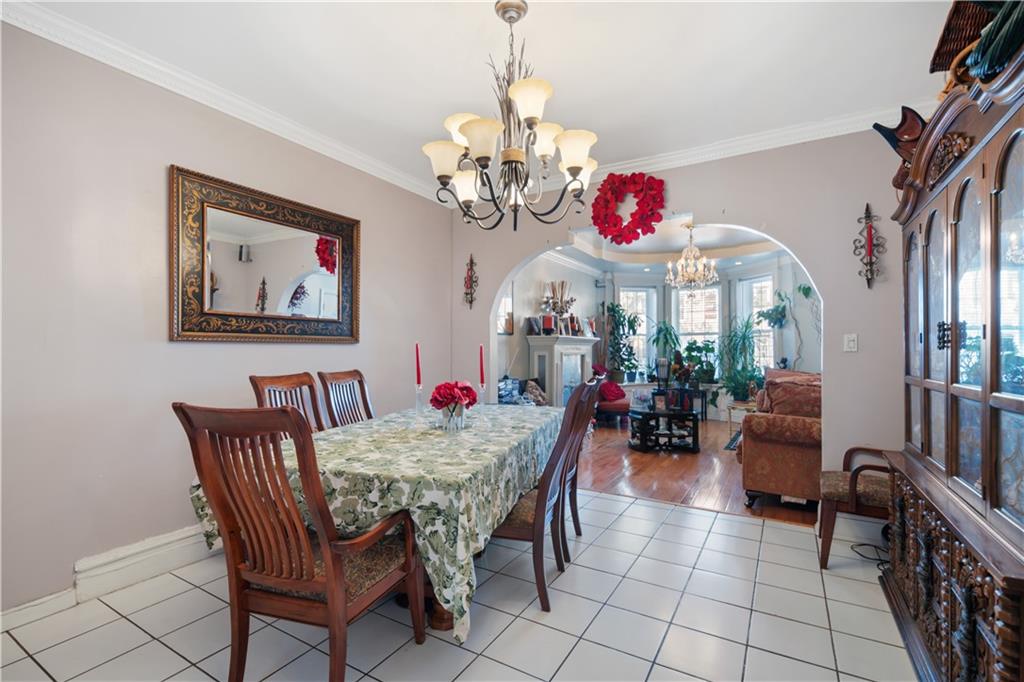 8 Raleigh Place Brooklyn, NY 11226 - Photo 3 of 21 a view of a dining room with furniture and a chandelier
