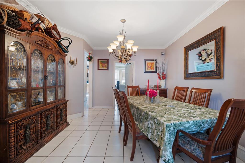 8 Raleigh Place Brooklyn, NY 11226 - Photo 5 of 21 a dining room with furniture and window