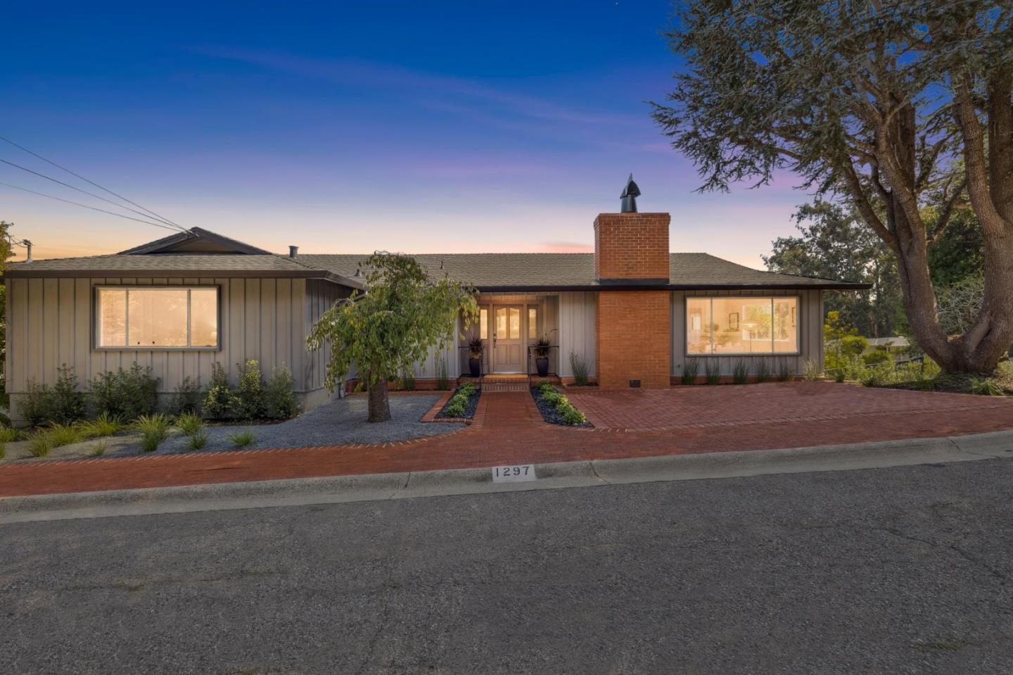 1297 Vista Grande Millbrae, CA 94030 - Photo 1 of 1 a front view of a house with a yard and garage