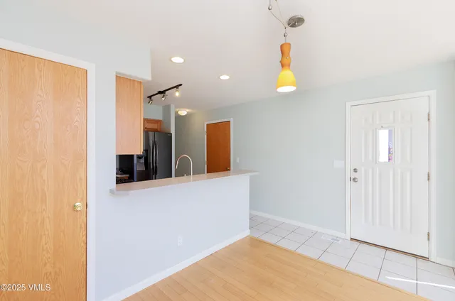 a view of a living room with wooden floor