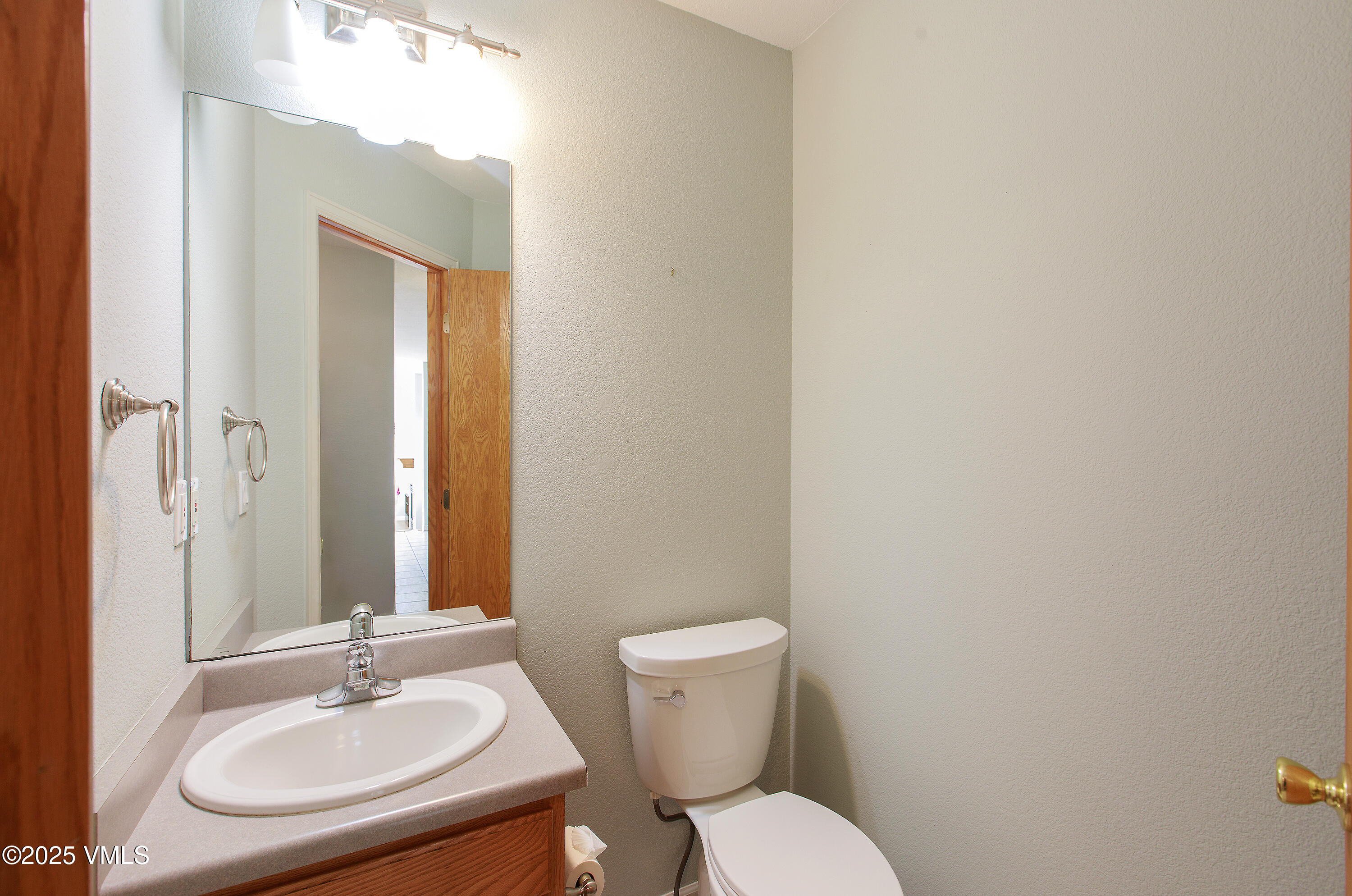 510 Brush Creek Terrace, Unit G3 Eagle, CO 81631 - Photo 13 of 29 a bathroom with a toilet a sink and mirror