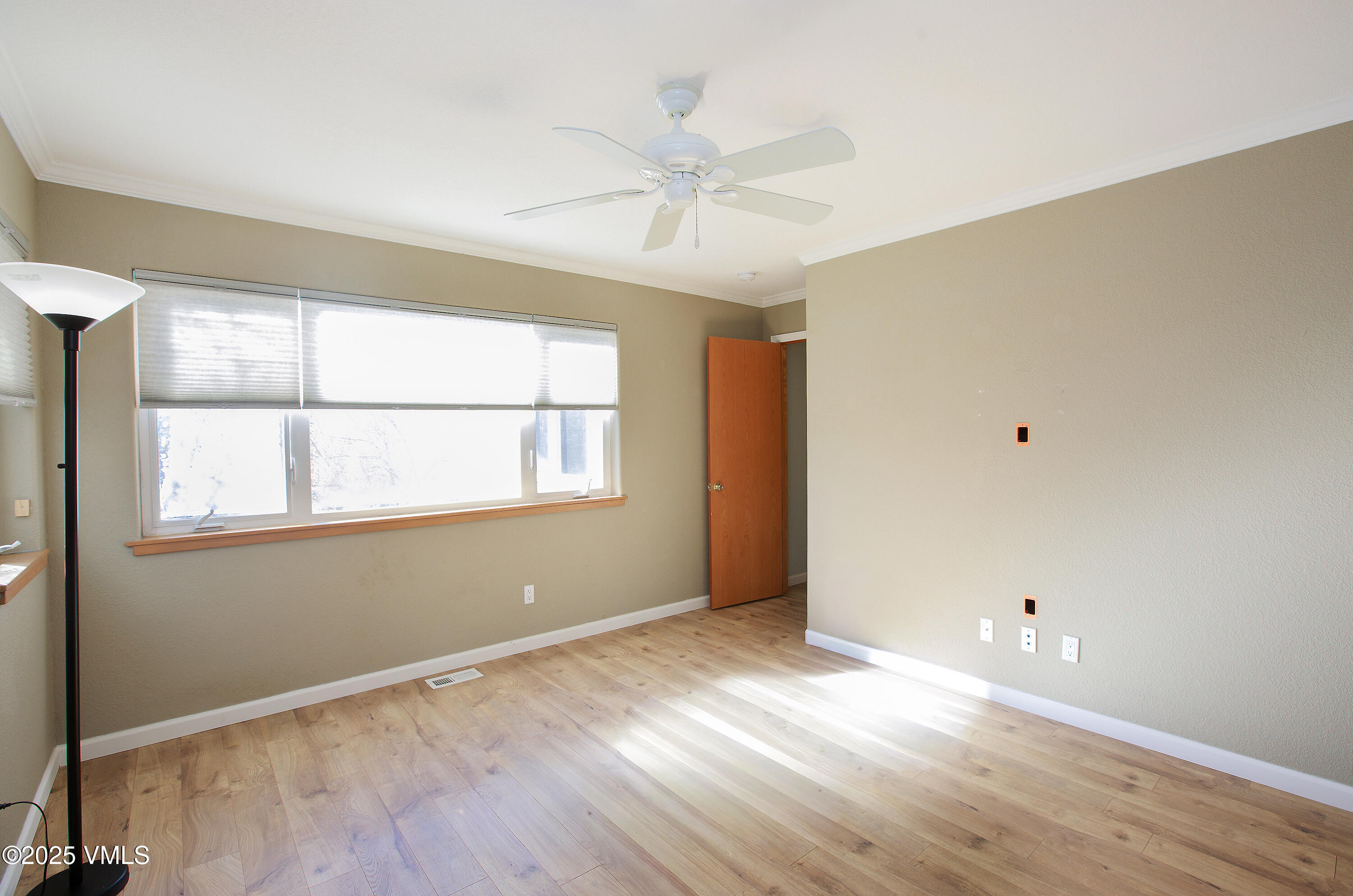 510 Brush Creek Terrace, Unit G3 Eagle, CO 81631 - Photo 17 of 29 a view of an empty room with wooden floor and a window