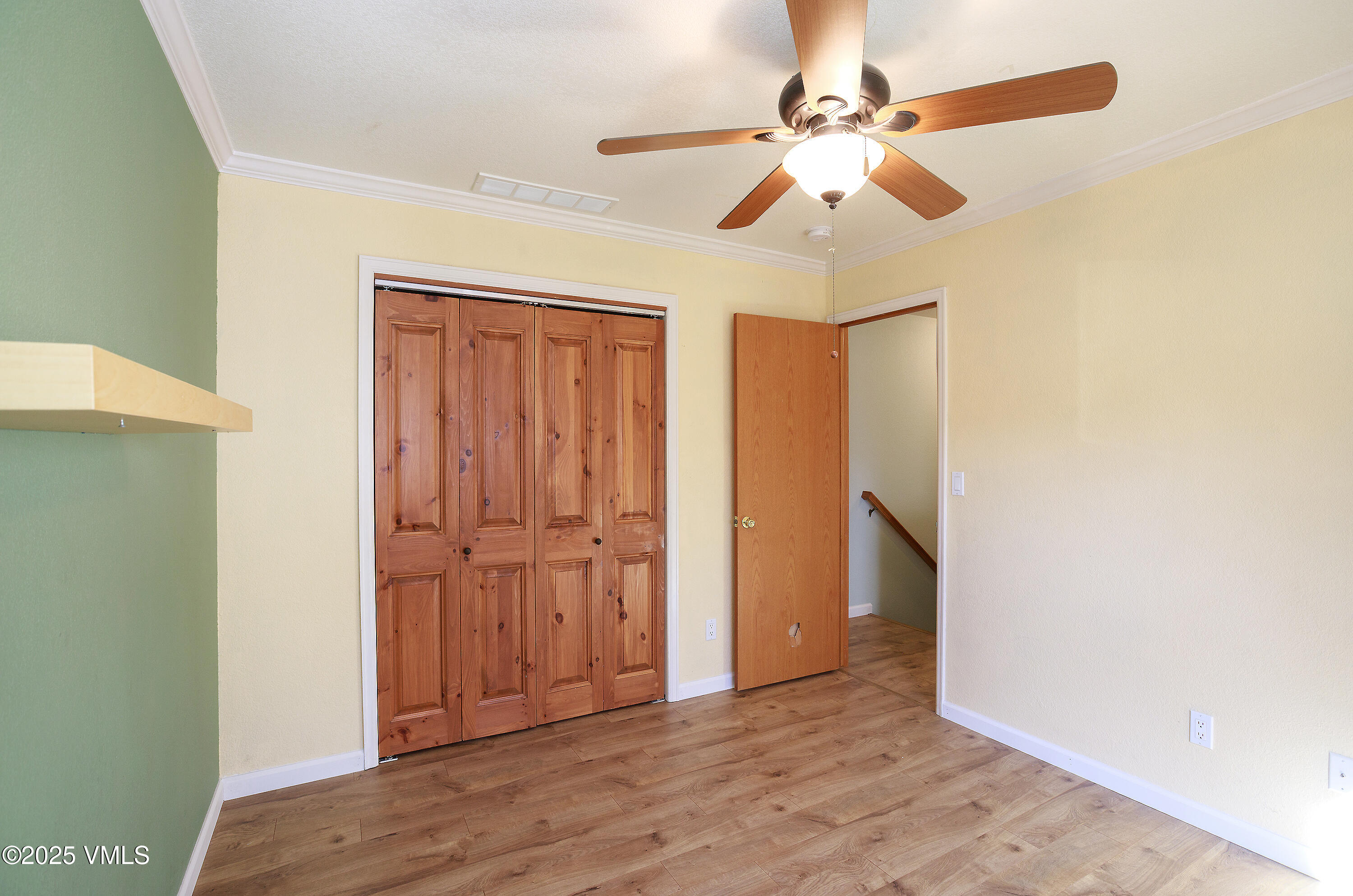 510 Brush Creek Terrace, Unit G3 Eagle, CO 81631 - Photo 22 of 29 a view of empty room with wooden floor