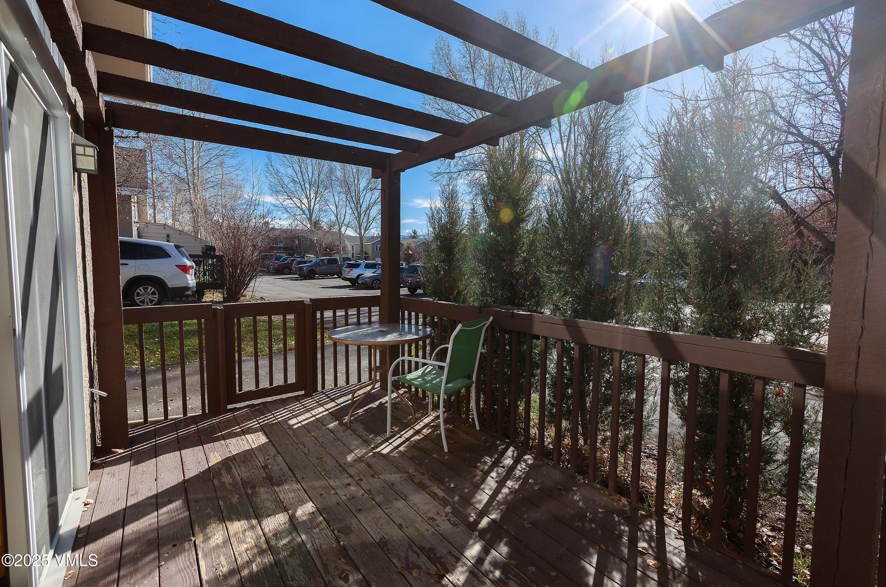 510 Brush Creek Terrace, Unit G3 Eagle, CO 81631 - Photo 28 of 29 a view of a balcony with chairs and wooden floor