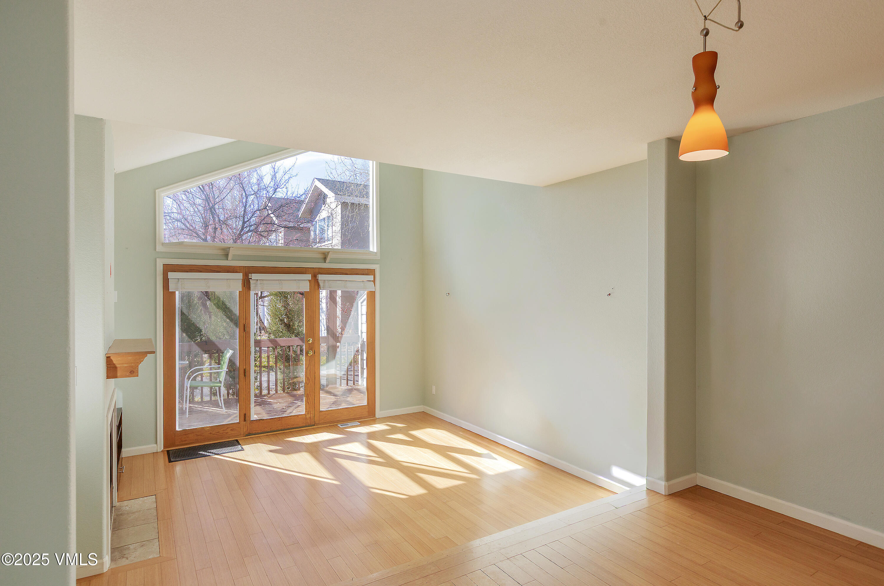 510 Brush Creek Terrace, Unit G3 Eagle, CO 81631 - Photo 3 of 29 an empty room with wooden floor and window